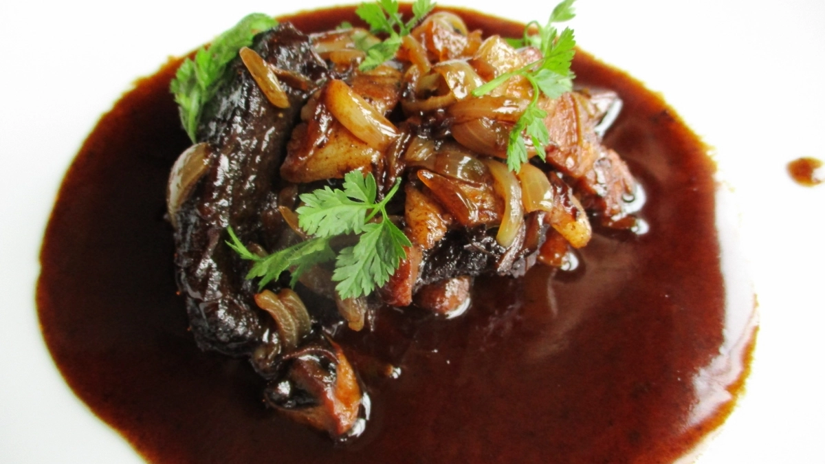 An American observance celebrating the classic French dish of chicken braised with wine, lardons, mushrooms, and garlic.
