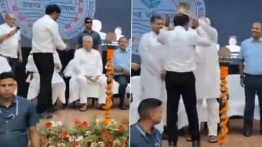 Patna: Bihar CM Nitish Kumar Places Flower Pot on the Head of a Man Welcoming Him During Event at LN Mishra Institute, Congress and RJD Slam Him for His Behaviour (Watch Video)
