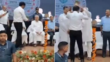 Nitish Kumar Places Flowerpot on Bureaucrat’s Head at Patna Event, RJD Questions His ‘Mental State’ (Watch Video)