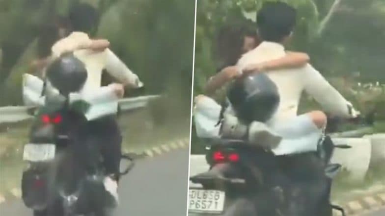 Noida Couple Romance Viral Video: Woman Sits on Bike’s Tank, Hugging Helmetless Rider on Yamuna Expressway, Traffic Police Issue INR 53,500 E-Challan