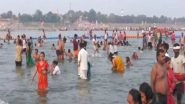 India News | Uttar Pradesh: Devotees Take Holy Dip in River Ganga, Offer Prayers on Jyeshtha Purnima