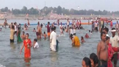India News | Uttar Pradesh: Devotees Take Holy Dip in River Ganga, Offer Prayers on Jyeshtha Purnima