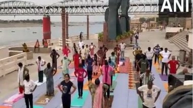 India News | Uttar Pradesh: People Perform Yoga at Namo Ghat Ahead of International Yoga Day