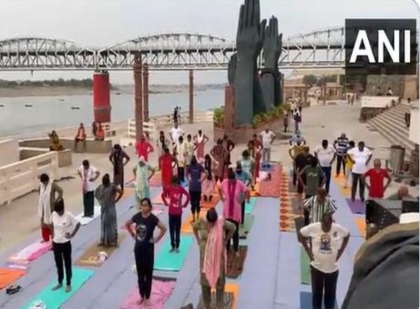 India News | Uttar Pradesh: People Perform Yoga at Namo Ghat Ahead of International Yoga Day