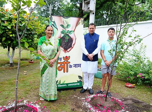 India News | Uttarakhand: CM Dhami Plants Sapling Along with His Mother and Son Under 'Ek Ped Maa Ke Naam' Campaign