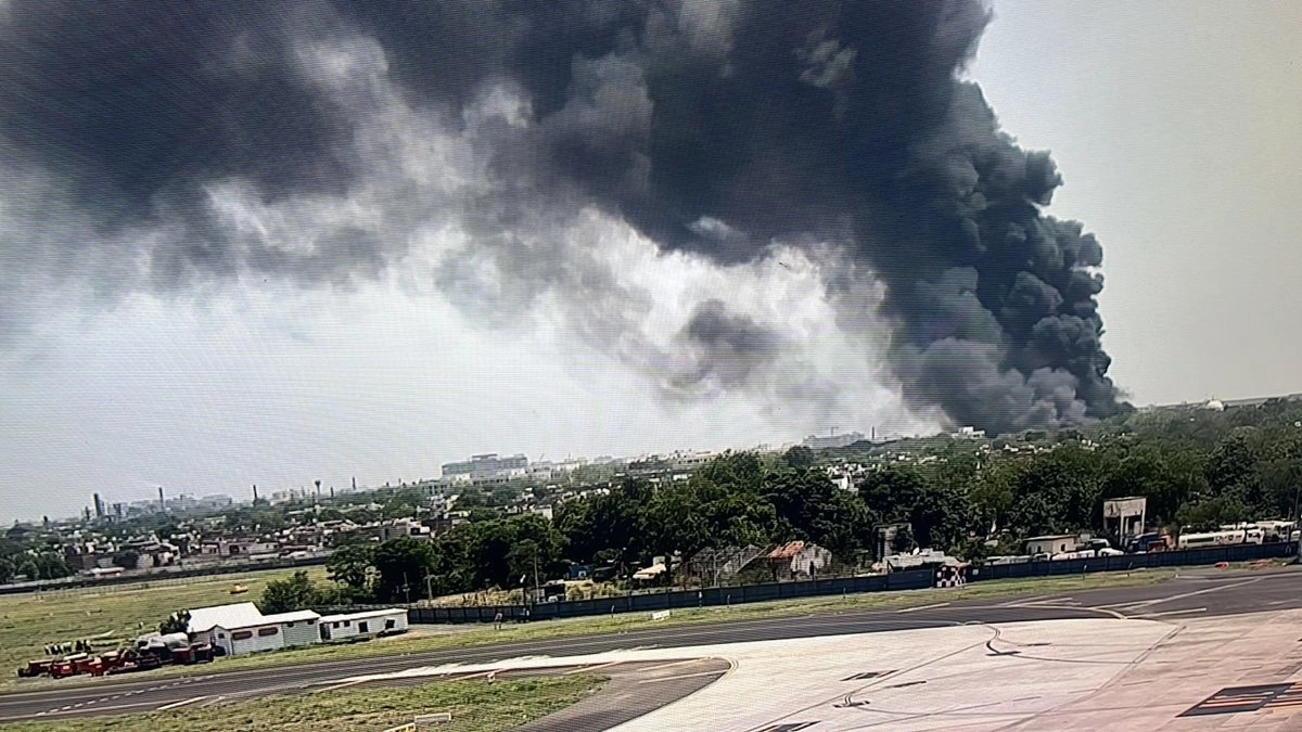 Early visuals from the crash site near the Meghaninagar IGP Compound in Ahmedabad depict a grim scene, with emergency services rushing to the area.