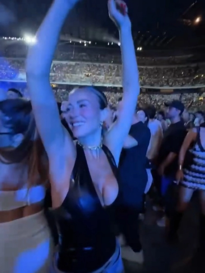 The photos show the DAZN presenter partying in high spirits, raising a toast and enjoying the luxury setting — all while rocking a bold and edgy outfit.