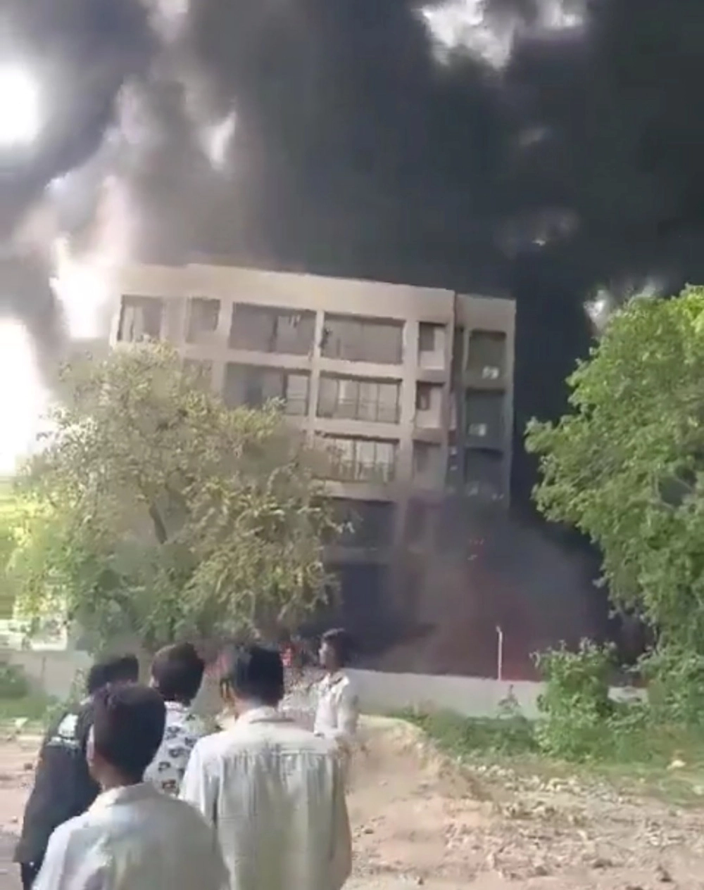 Residents and students describe scenes of chaos and panic as the plane went down near Meghaninagar IGP Compound, with loud explosions heard.