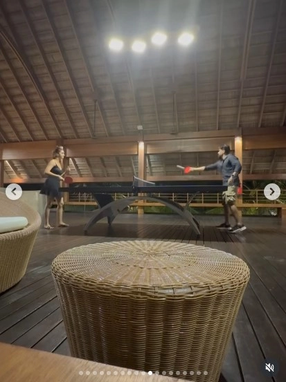 Not just serene beach shots—they're playing table tennis together, showing playful side to their love.