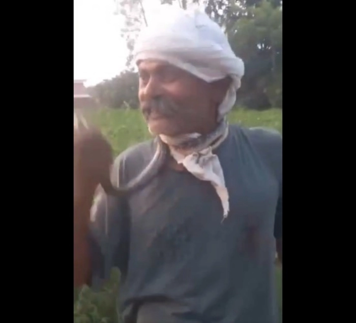 As Kumar wrapped the snake around his neck and brought its head close, he extended his tongue—prompting the snake to bite him directly on the tongue. The terrifying moment was captured on video.