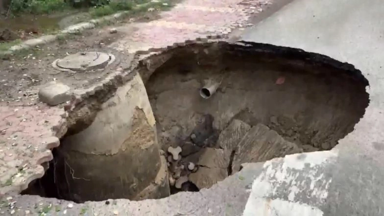 Noida Road Cave-In: No Injuries Reported After Service Road Collapses Near Sector 100 Following Heavy Rainfall, Videos Surface