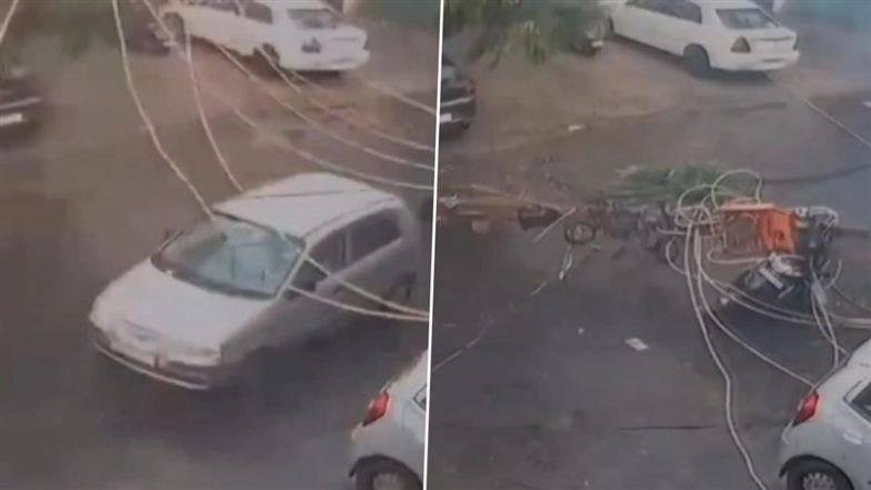 Terrifying Escape in Delhi: Woman Narrowly Survives After Electric Pole Falls on Moving Scooter in Tagore Garden, CCTV Video Goes Viral