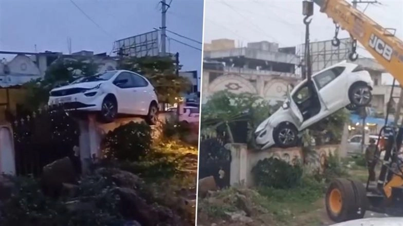Hyderabad: Drunk Driver Crashes Car Onto House Boundary Wall in Shambipur, JCB Crane Used To Bring Vehicle Down (Watch Video)