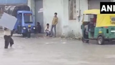 India News | Gujarat: Heavy Rainfall Triggers Waterlogging in Parts of Ahmedabad