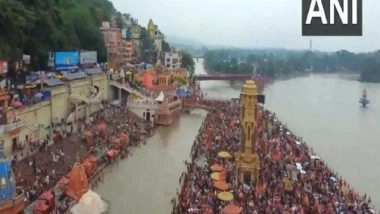 India News | Uttarakhand: Thousands of Kanwar Pilgrims Collect Holy Water at Har Ki Pauri