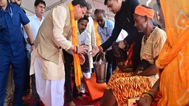 India News | Uttarakhand CM Welcomes Kanwariyas in Haridwar, Washes Feet of Pilgrims