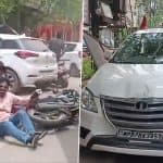 Gwalior: Tulsi Ram Silawat’s Convoy Meets With Accident Near Patel Nagar, Passing Biker Suffers Minor Injuries After One of the Vehicles Collide With Divider; Video Surfaces