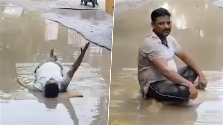 Kanpur Father Lies in Water-Filled Pothole With Mat and Pillow After Daughter Falls on Way to School, Video of Protest Over Bad Roads Goes Viral