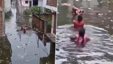 Prayagraj Floods: Couple Carries Newborn Through Inundated Streets Amid Ganga Overflow, No Boat Support Available (Watch Video)
