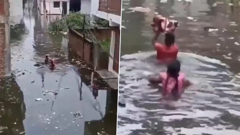 Prayagraj Floods: Couple Carries Newborn Through Inundated Streets Amid Ganga Overflow, No Boat Support Available (Watch Video)