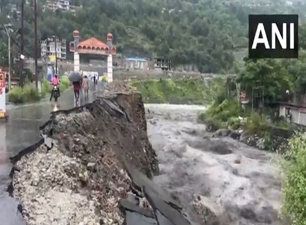 India News | Himachal Pradesh Rains: Road Damaged Near Bhoothnath Bridge over the Raging Beas River in Kullu