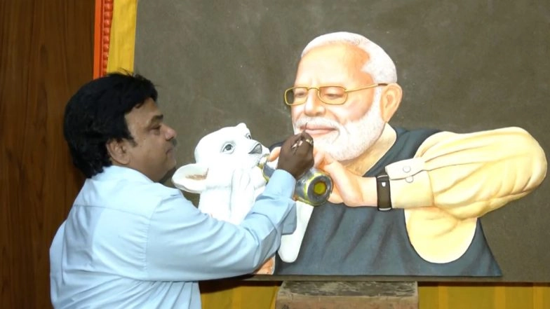 PM Modi Birthday 2025: Rajasthan Artist Mahesh Kumar Vaishnav Pays Unique Tribute to Narendra Modi, Creates Cow Dung Painting Depicting PM Feeding Lion Cub (Watch Video)