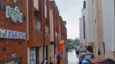 India News | Gujarat: Residents in Vadodara's Vadsar Area Stranded Owing to Heavy Rains, Municipal Corporation Provides Relief Materials