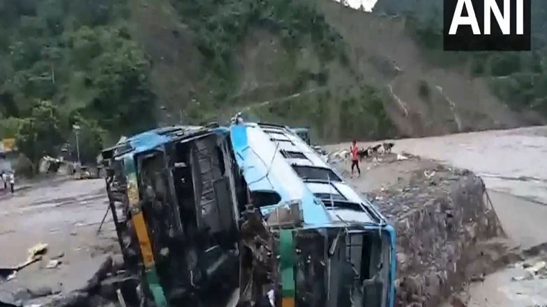 India News | Himachal Pradesh: Heavy Rain Wreaks Havoc in Dharampur, Bus Stand Submerged, Vehicles Swept Away