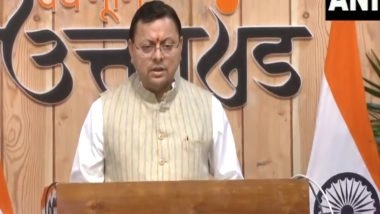 India News | Uttarakhand CM Addresses Foundation Stone Laying Ceremony of Roads Reconstructed Under Central Road Infrastructure Fund in Udham Singh Nagar