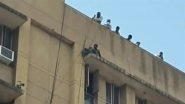 Delhi: Man Sits on Edge of Sanjay Gandhi Hospital Roof in Mangolpuri, Rescue Operation Underway (Watch Video)
