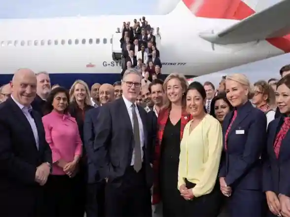 World News | British PM Starmer Joins His Business Delegation for a Photo at London's Heathrow Airport Ahead of India Visit