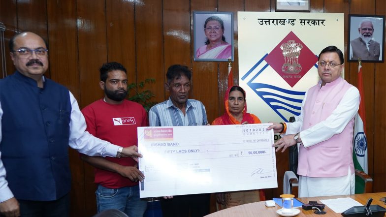 India News | Following Deaths of Three Personnel in Separate Road Accidents, CM Dhami Hands over Cheques of Rs 50 Lakh Each to Their Dependents