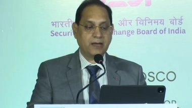 Business News | SEBI Chief Says, Establishing Easy, Secure KYC Access for NRIs for Market Participation is Urgent Goal