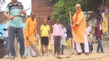 India News | Chhath Puja 2025: Bihar Minister Prem Kumar Joins Cleanliness Drive at Gaya's Pitamaheshwar Ghat Ahead of Sandhya Arghya