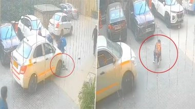 Accident Caught on Camera in Greater Noida: Schoolboy Miraculously Escapes After Cab Runs Over Him Inside Ajnara Homes Society, Video Goes Viral