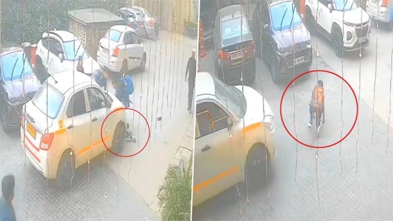 Accident Caught on Camera in Greater Noida: Schoolboy Miraculously Escapes After Cab Runs Over Him Inside Ajnara Homes Society, Video Goes Viral