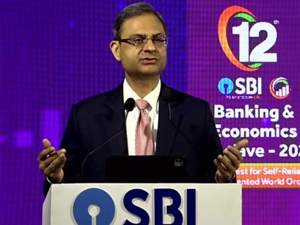 Business News | SBI Transformed from Being in Loss in 2018 to USD 100 Bn Company, Due to Regulatory Reforms by RBI: Governor Malhotra