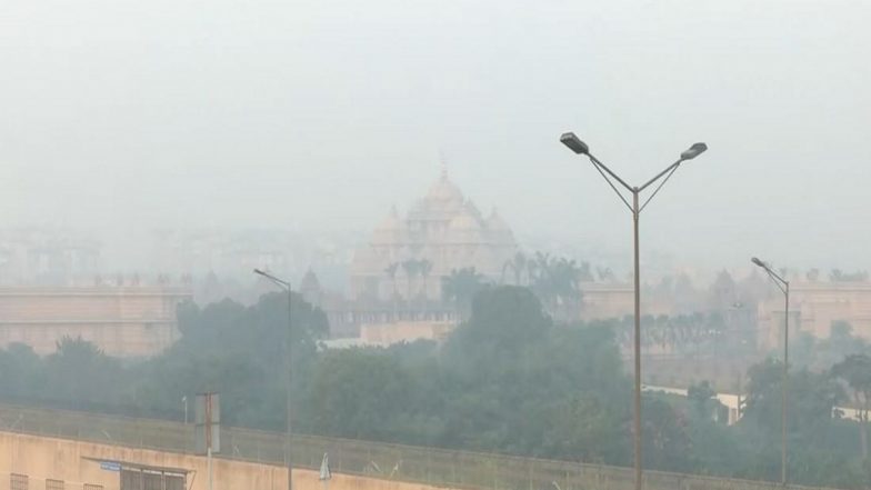 India News | Air Pollution: AAP Claims Delhi Govt Sprinkling Water on Monitors to Falsify Readings, BJP Says Problem Emerged over Last 10 Years
