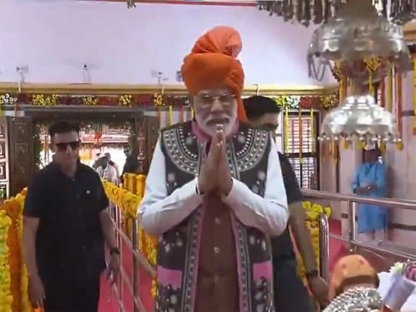 India News | Gujarat: PM Modi Holds Roadshow in Narmada, Offer Prayers at Devmogra Temple