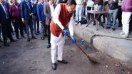 India News | Uttarakhand CM Dhami Makes Surprise Inspection of ISBT Dehradun, Picks Up Broom to Clean Premises