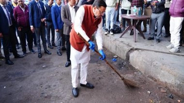 India News | Uttarakhand CM Dhami Makes Surprise Inspection of ISBT Dehradun, Picks Up Broom to Clean Premises