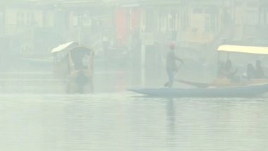 India News | Cold Wave Grips Kashmir Valley; Srinagar Records Sub-zero Temperatures as Residents Brave Harsh Winter