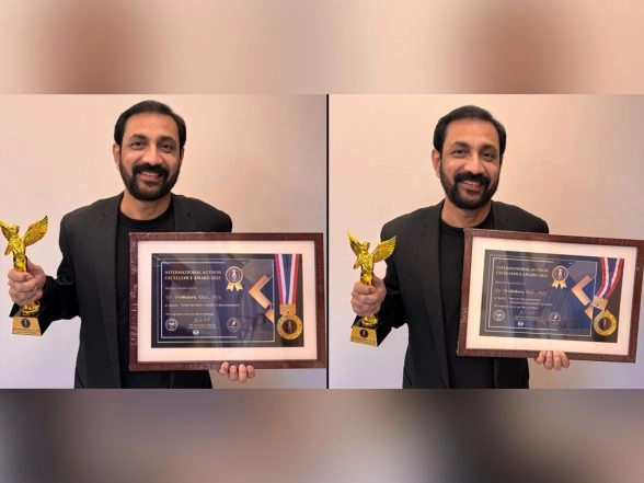 Business News | Renowned Dermatologist and Author Dr. Prabhakara VG Honoured with Double Awards at IAEA 2025