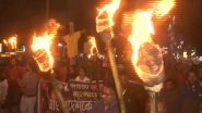 India News | West Bengal: BJP Workers Hold Torchlight Rally in Siliguri Against Atrocities on Hindus in Bangladesh