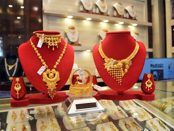 Business News | Gold Set to Extend Rally in 2026 as Investors Hedge Against Market Bubbles: Report