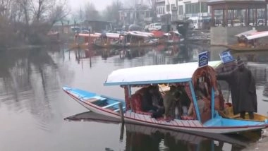 India News | J-K: Tourists Brave Chilly Morning at Dal Lake Amid Cold Wave