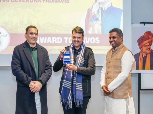 World News | Davos: CM Fadnavis Accepts World Economic Forum Badge Representing 'Magnetic Maharashtra'; Praises Diaspora for Cultural Connect