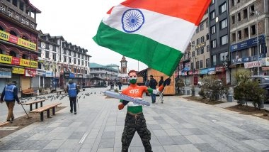 India News | Tourist Paints Himself in Tricolour as He Marks 77th Republic Day at Srinagar's Lal Chowk