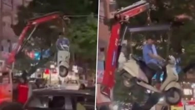 Pune Viral Video: Man Lifted Mid-Air by Towing Crane After Refusing To Step Down From Scooter