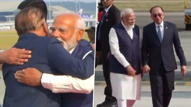 PM Modi in Malaysia: Prime Minister Narendra Modi Arrives in Kuala Lumpur, Welcomed by Malaysian Counterpart Anwar Ibrahim at Airport (Watch Videos)